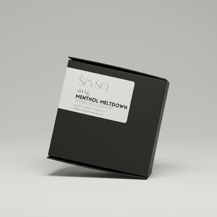 Black box with a white label featuring 'SKIN SO' and 'Menthol Meltdown' on a wooden surface.